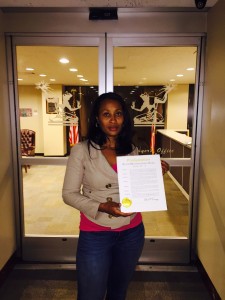 Kiddada Green, BMBFA Founding Executive Director receiving The City of Detroit Black Breastfeeding Week Proclamation.